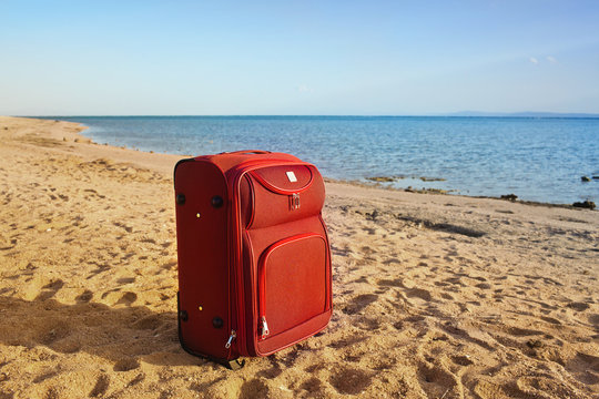 suitcase on a desert beach
