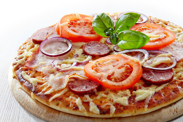 Salami and tomato pizza