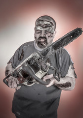 Fototapeta premium zombie with mechanical saw