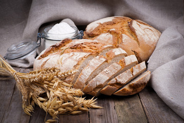 Fresh bread on wooden ground