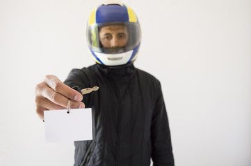 Biker with helmet and offering with copy space
