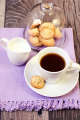 Fototapeta na wymiar Cup of coffee, little spritz biscuits