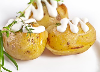 Baked potato with sour cream sauce, selective focus