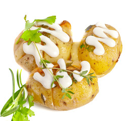 Baked potato with sour cream sauce, selective focus