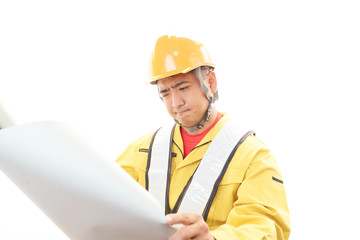 疲れた表情の作業員