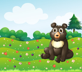 Obraz na płótnie Canvas A brown bear sitting in the garden