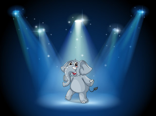 An elephant dancing in the middle of the stage
