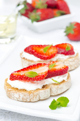 bruschetta with goat cheese, fresh strawberries and mint
