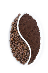 coffee beans and ground coffee in a white plate