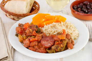 feijoada with rice and orange on the plate