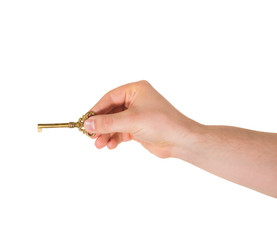Hand holding a key isolated