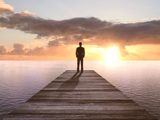 man standing on pier