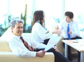 Businessmen discuss the deal.