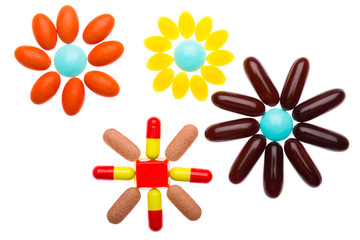 Colorful pills on white background