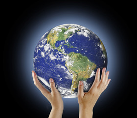 Planet Earth in hand.Elements of this image furnished by NASA