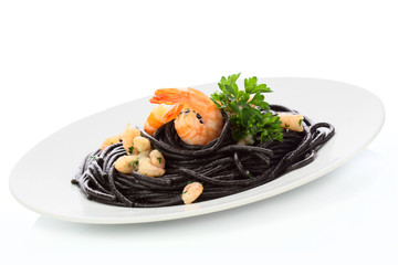 Black spaghetti with shrimps isolated om white
