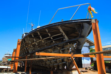 Military boat on repair in dry dock