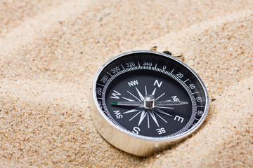 compass on the hot sand