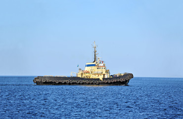 Fototapeta premium Tugboat in harbor quayside on Odessa, Ukraine