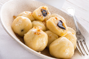 Potato dumplings with plums full