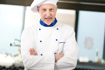 Mature chef in his kitchen