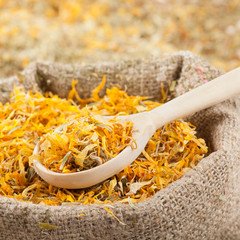 sack of healing herbs and wooden scoop, herbal medicine