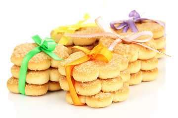 Fototapeta na wymiar Sweet cookies tied with colorful ribbons isolated on white