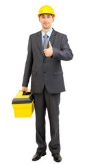 Young businessman in helmet with box isolated on white.