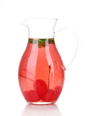 Cherry drink in pitcher isolated on white.