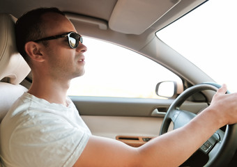 Man driving a car. Inside shoot
