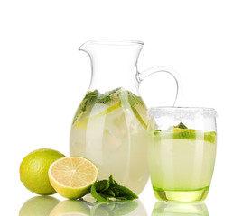 Lemonade in pitcher and glass isolated on white