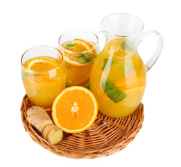 Orange lemonade in pitcher and glasses isolated on white