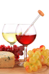 Glasses of wine, tasty blue cheese and grape