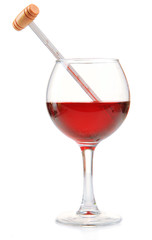 Glass of wine with thermometer, isolated on white