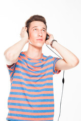 young and handsome man listening to music on headphones