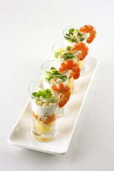 verrine salad with  cheese  served in glass with a shrimp on top