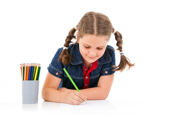 Cute child draw with colorful crayons, isolated over white