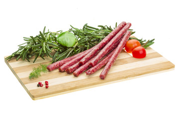 Salami with rosemary, basil and tomato