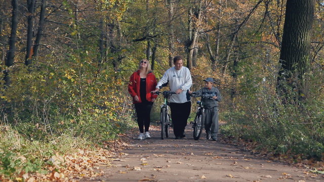 active outdoor recreation, happy family,  walk with bike