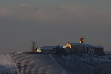 village between the vineyards in the snow