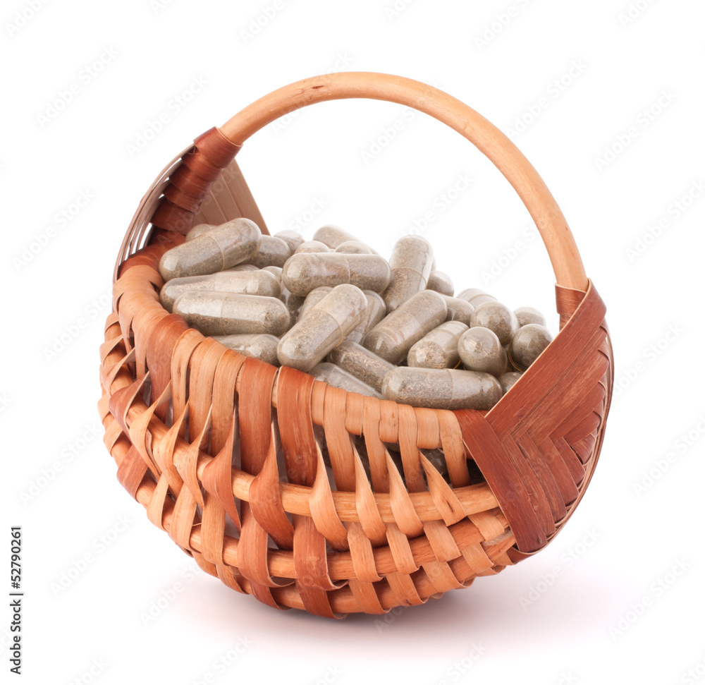 Sticker Herbal drug capsules in wicker basket. Alternative medicine conc