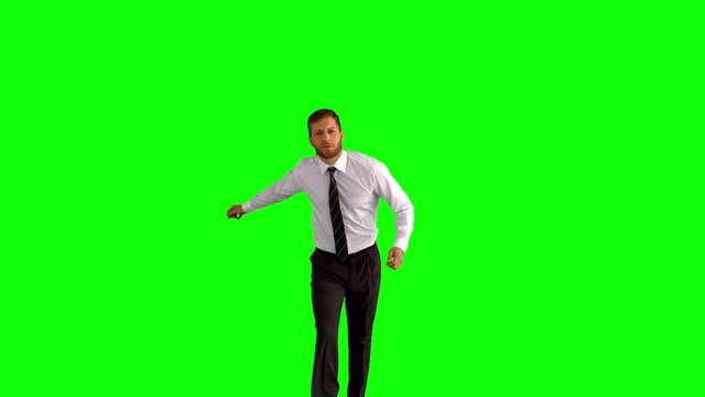 Businessman jumping up and clicking his heels