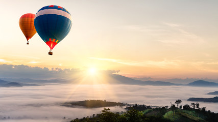 Hot air balloon over sea of mist