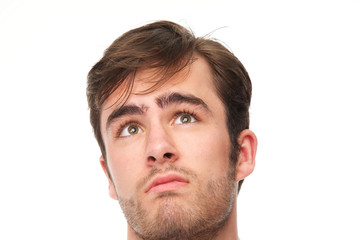 Obraz premium Portrait of a handsome young man looking up