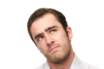 Obraz premium Handsome young man looking up, isolated on white