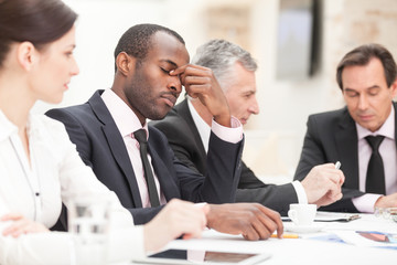 Tired businessman during meeting