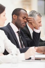 Fatigued executive deep in thought