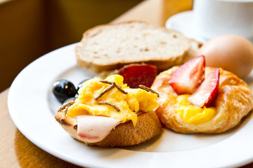 Healthy breakfast with bread, egg and strawberry