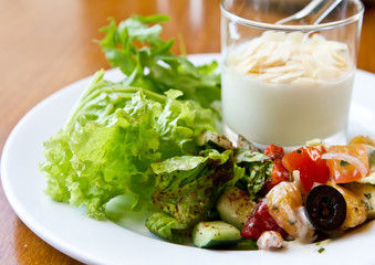 Healthy breakfast with yogurt and green salad