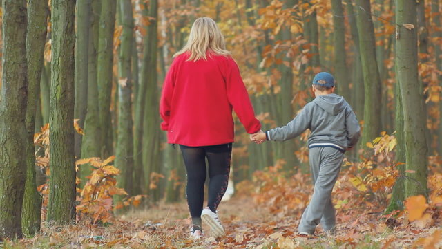 mother and son, autumn walk